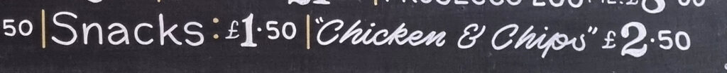 Part of a pub's menu board showing "Chicken & Chips" £2.50